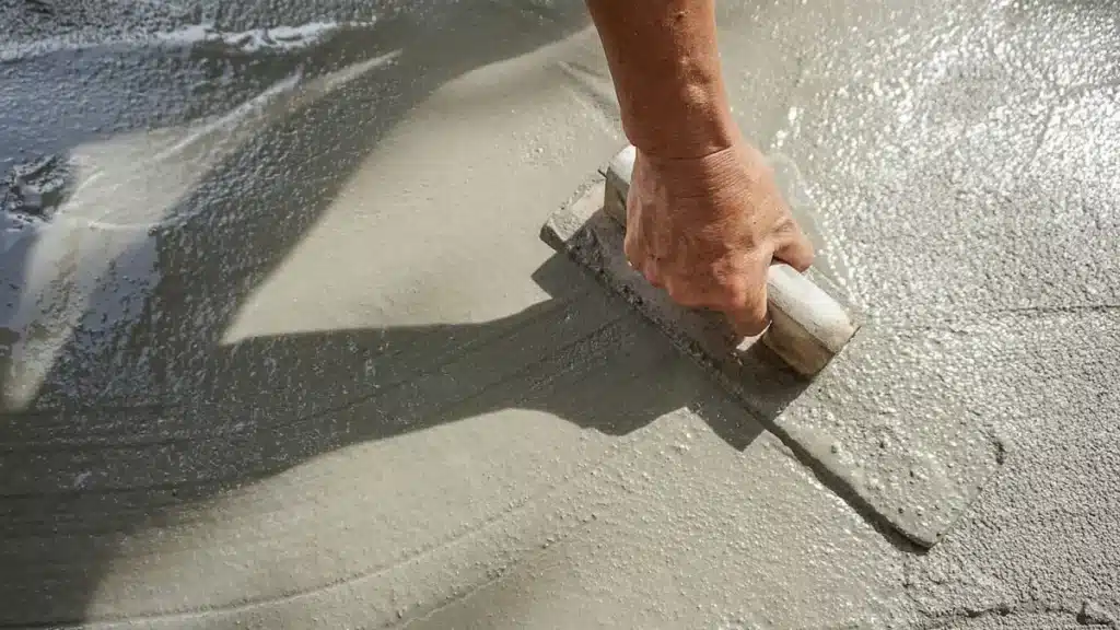 contractor spreads concrete before allowing it to cure for proper time