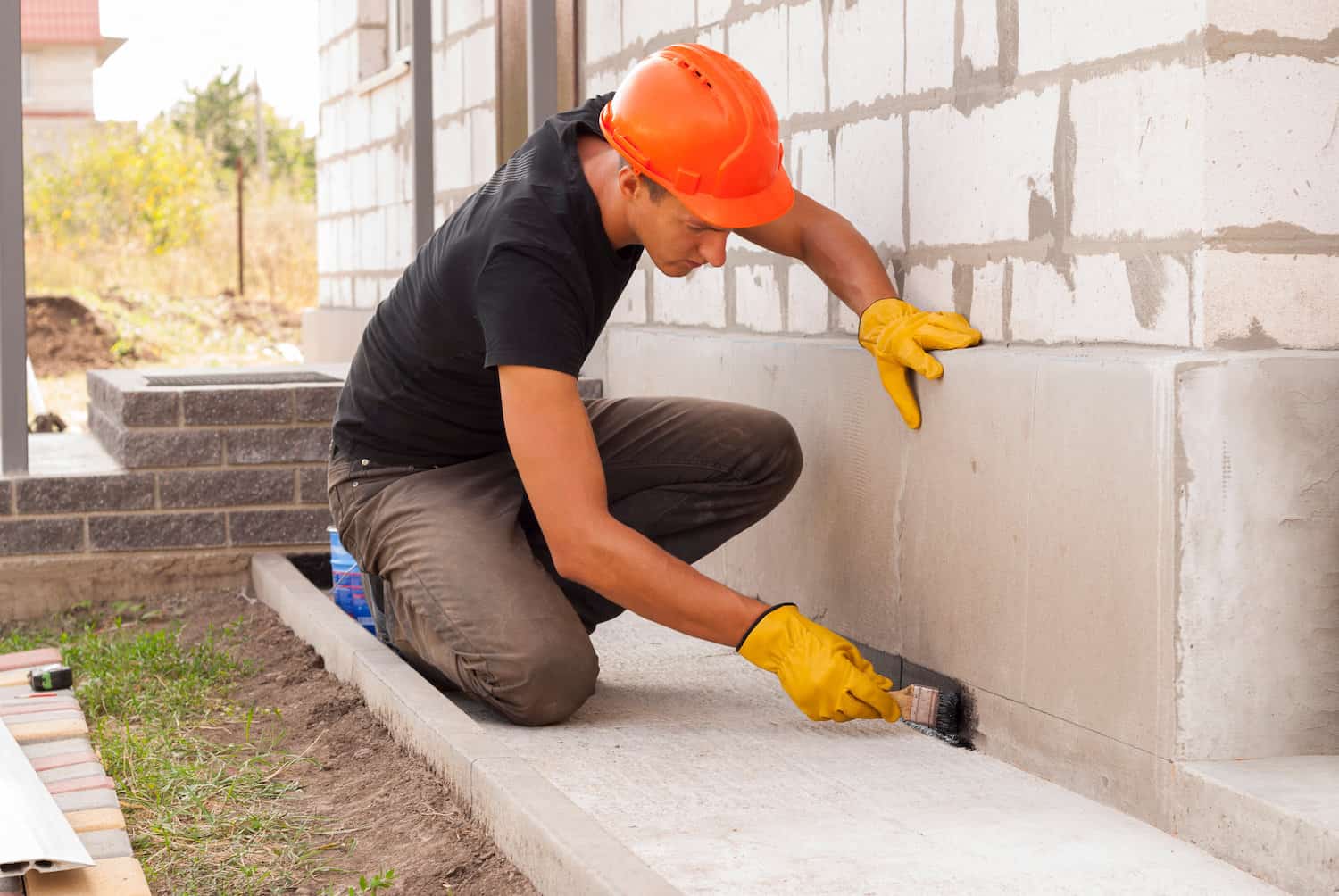 how much does it cost to replace a foundation worker painting foundation